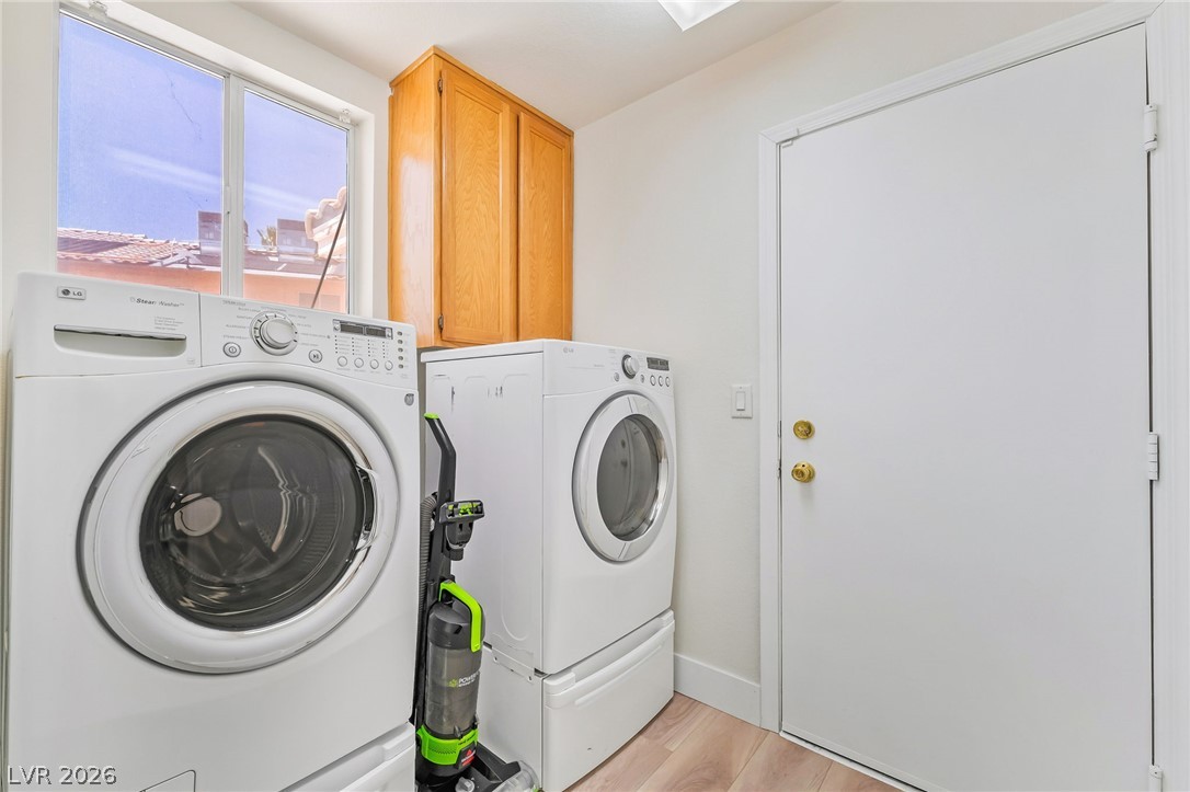 104 Appian Way Henderson, NV 89002 - Photo 14 of 24 A well-appointed laundry area features modern appliances and convenient cabinetry.