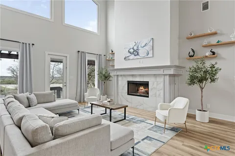 a kitchen with white cabinets and a stove