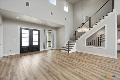 a large kitchen with kitchen island a counter space a sink and appliances