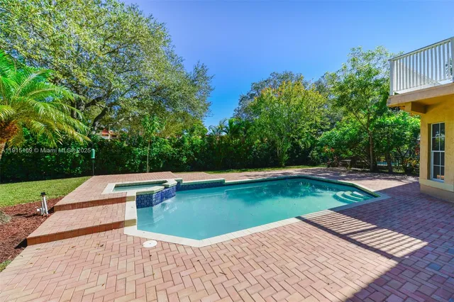 a view of a livingroom with a fireplace and window