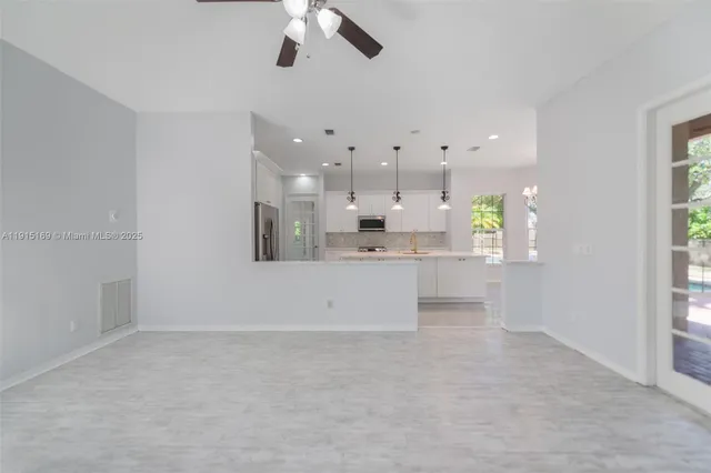 a view of an empty room with a window