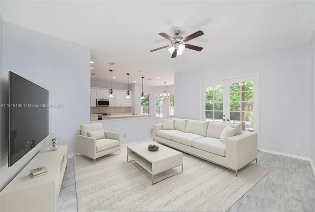 a view of an empty room with a ceiling fan