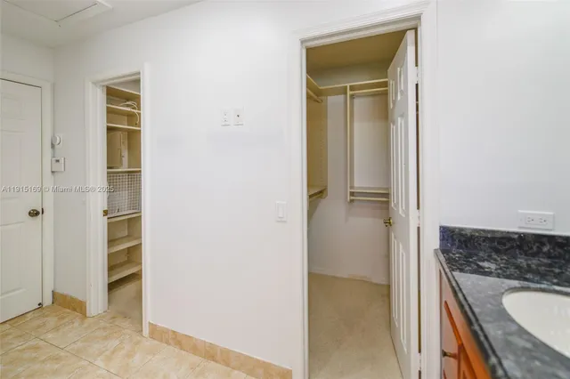 a front view of a house with a yard table and chairs