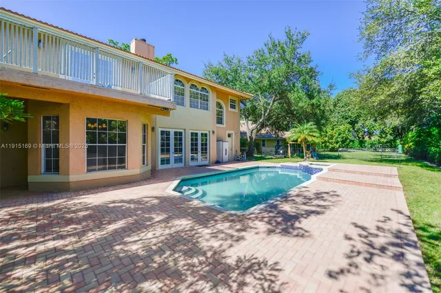 a backyard of a house with lots of green space