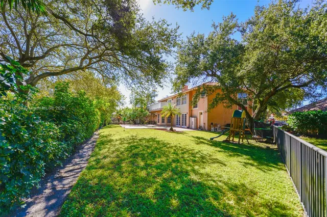 a view of an empty room with windows