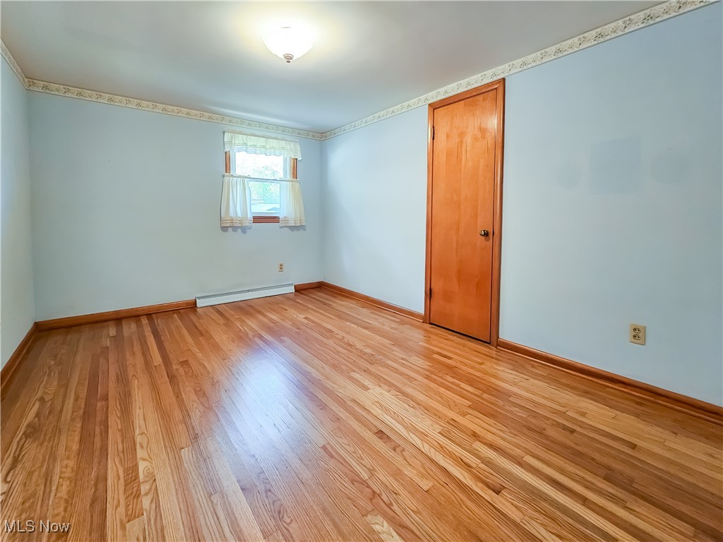 6040 Firestone Road Northeast Canton, OH 44721 - Photo 9 of 26 Bedroom 1 - Hardwood flooring