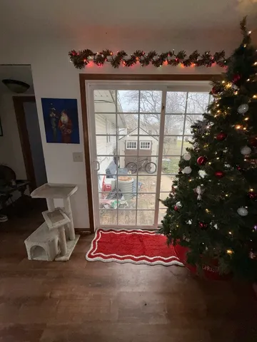 a room with gym equipment and a flat screen tv