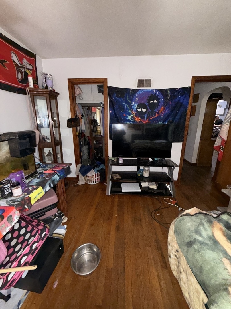 407 North 1st Street Fairbury, IL 61739 - Photo 21 of 22 a room with gym equipment and a flat screen tv