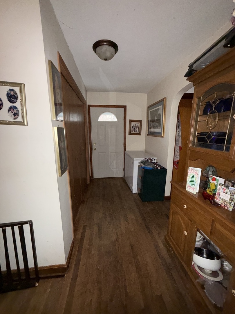 407 North 1st Street Fairbury, IL 61739 - Photo 6 of 22 a living room with furniture and a flat screen tv