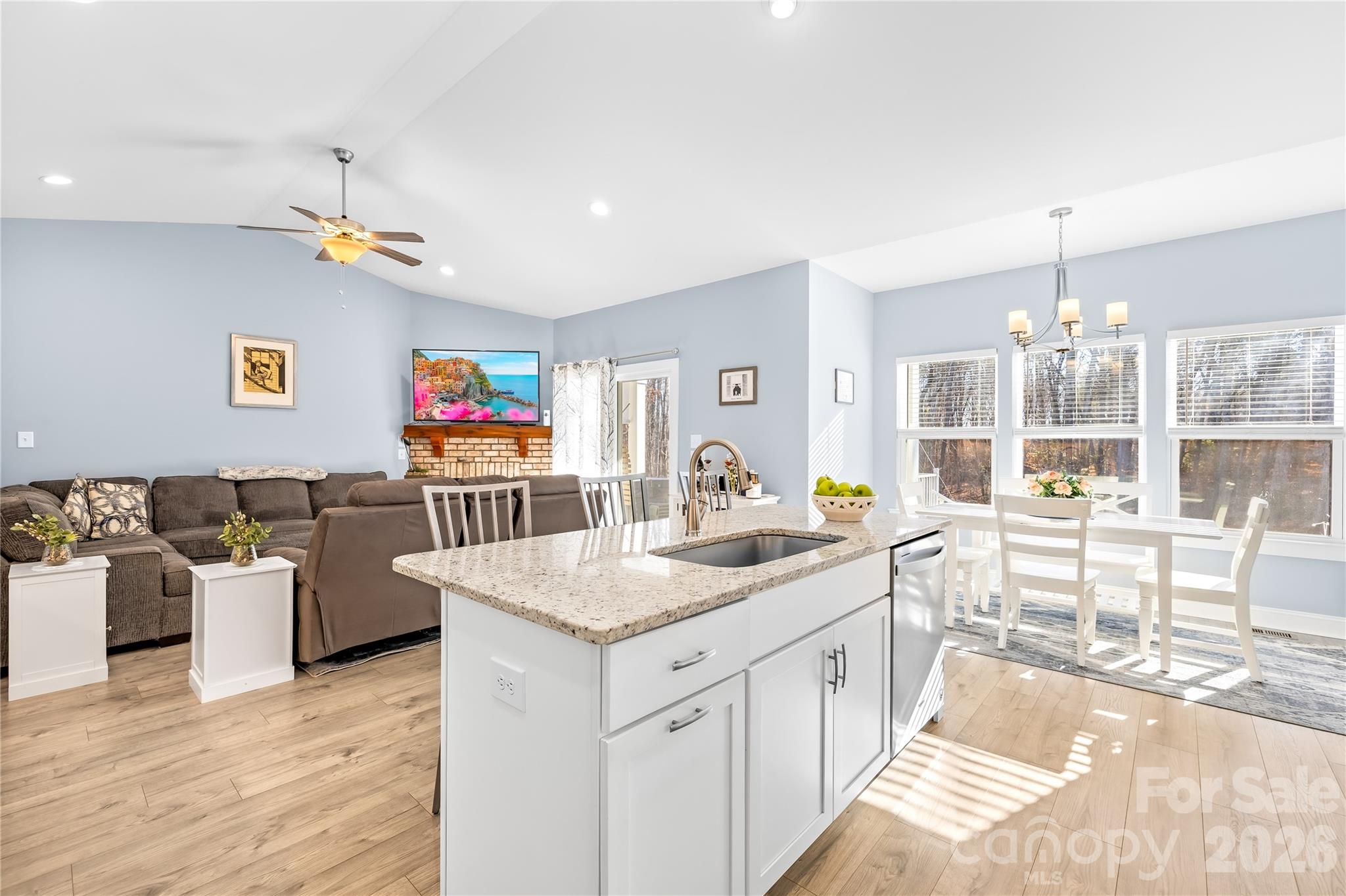 1600 Barefoot Road Catawba, NC 28609 - Photo 13 of 34 a open kitchen with stainless steel appliances granite countertop a sink dishwasher a dining table and chairs with wooden floor