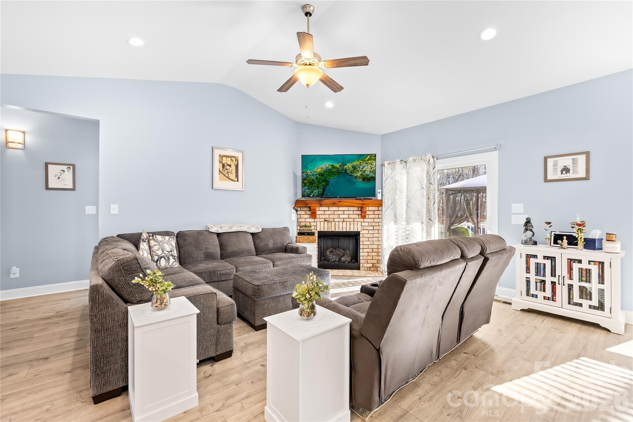 1600 Barefoot Road Catawba, NC 28609 - Photo 7 of 34 a living room with furniture a fireplace and a flat screen tv