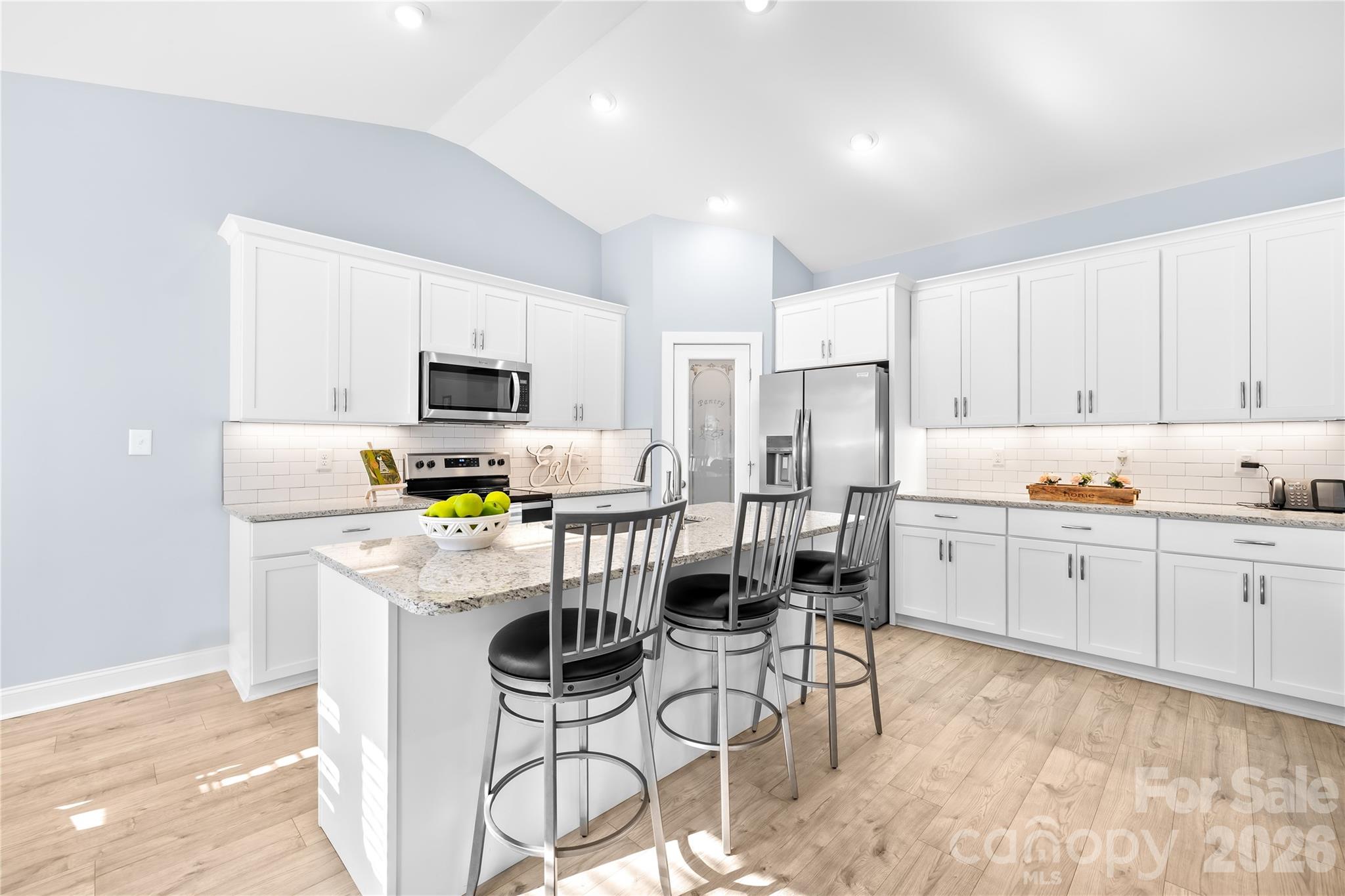 1600 Barefoot Road Catawba, NC 28609 - Photo 10 of 34 a kitchen with stainless steel appliances white cabinets and wooden floor