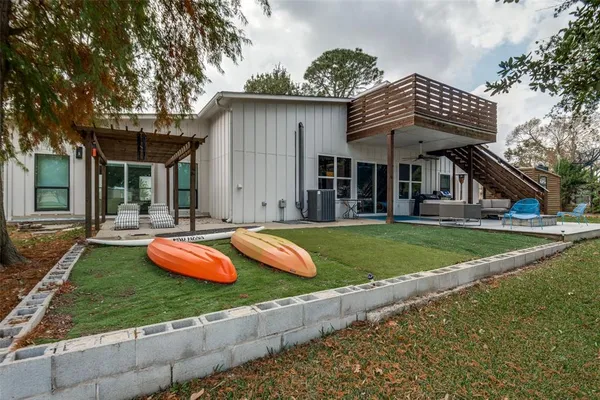 a view of a house with swimming pool and porch