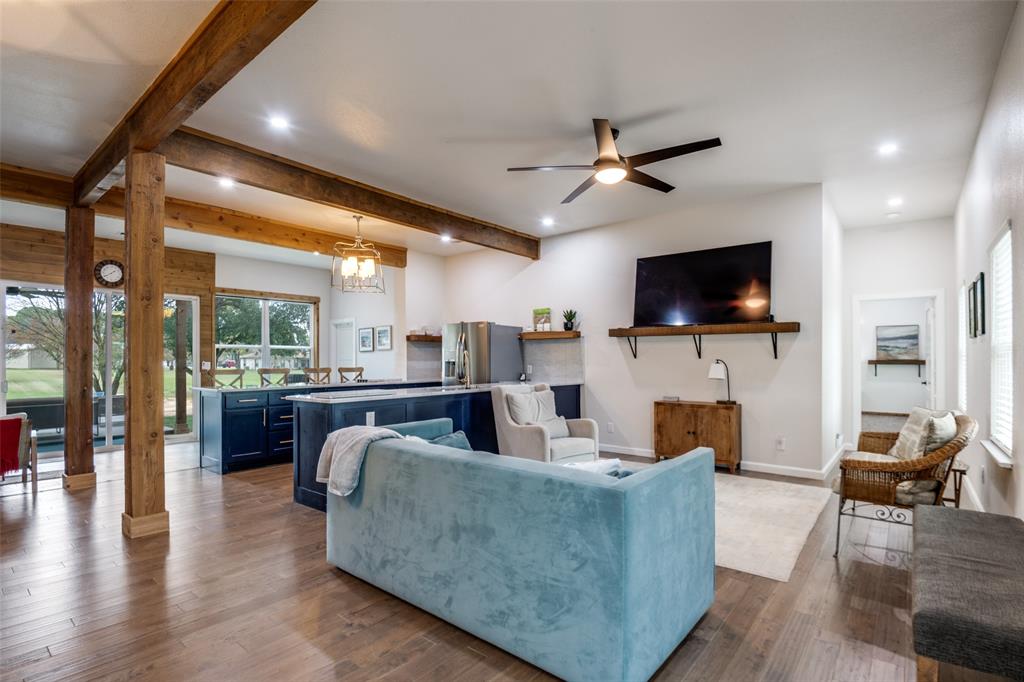 107 Slaughter Ranch Road Trinidad, TX 75163 - Photo 8 of 12 a living room with fireplace furniture and a flat screen tv