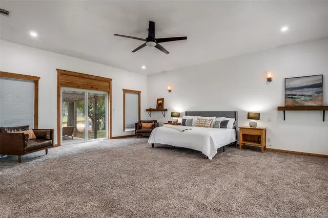 a living room with furniture and a ceiling fan