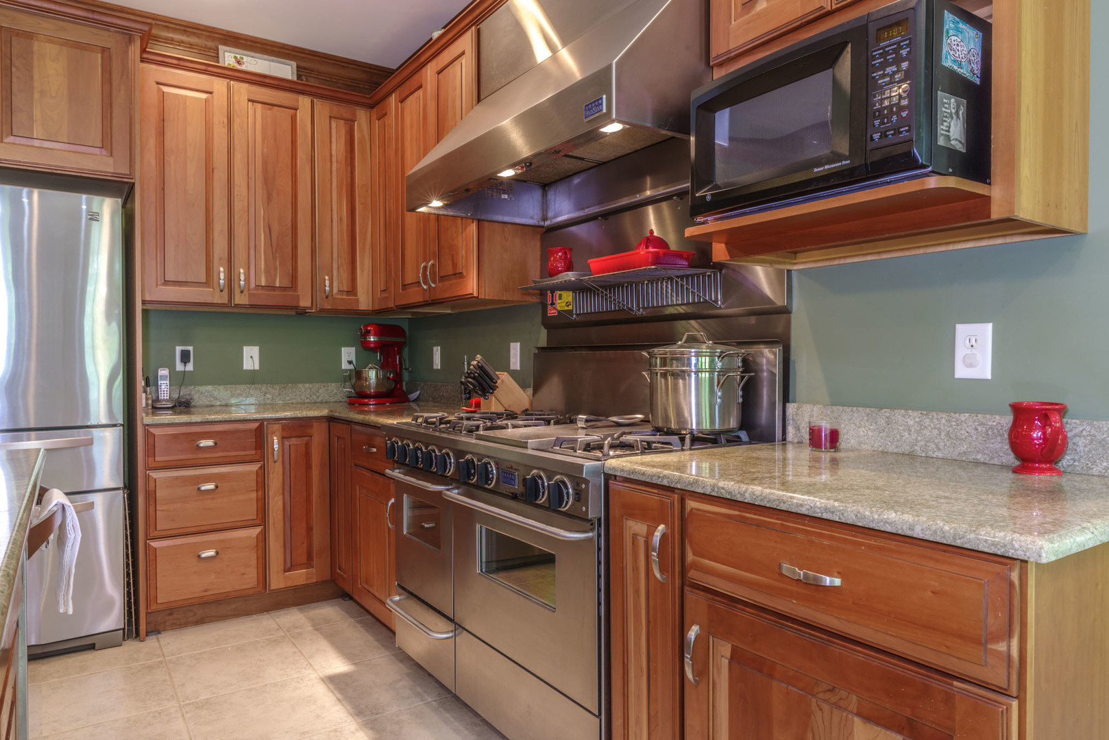 21221 Hidden Valley Loop Lexington, IL 61753 - Photo 15 of 44 a kitchen with stainless steel appliances granite countertop a stove and a sink