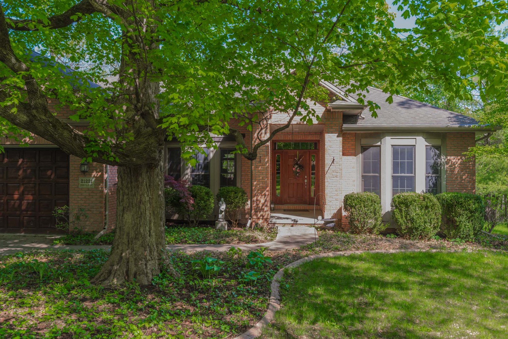 21221 Hidden Valley Loop Lexington, IL 61753 - Photo 2 of 44 a view of a house with backyard and a tree