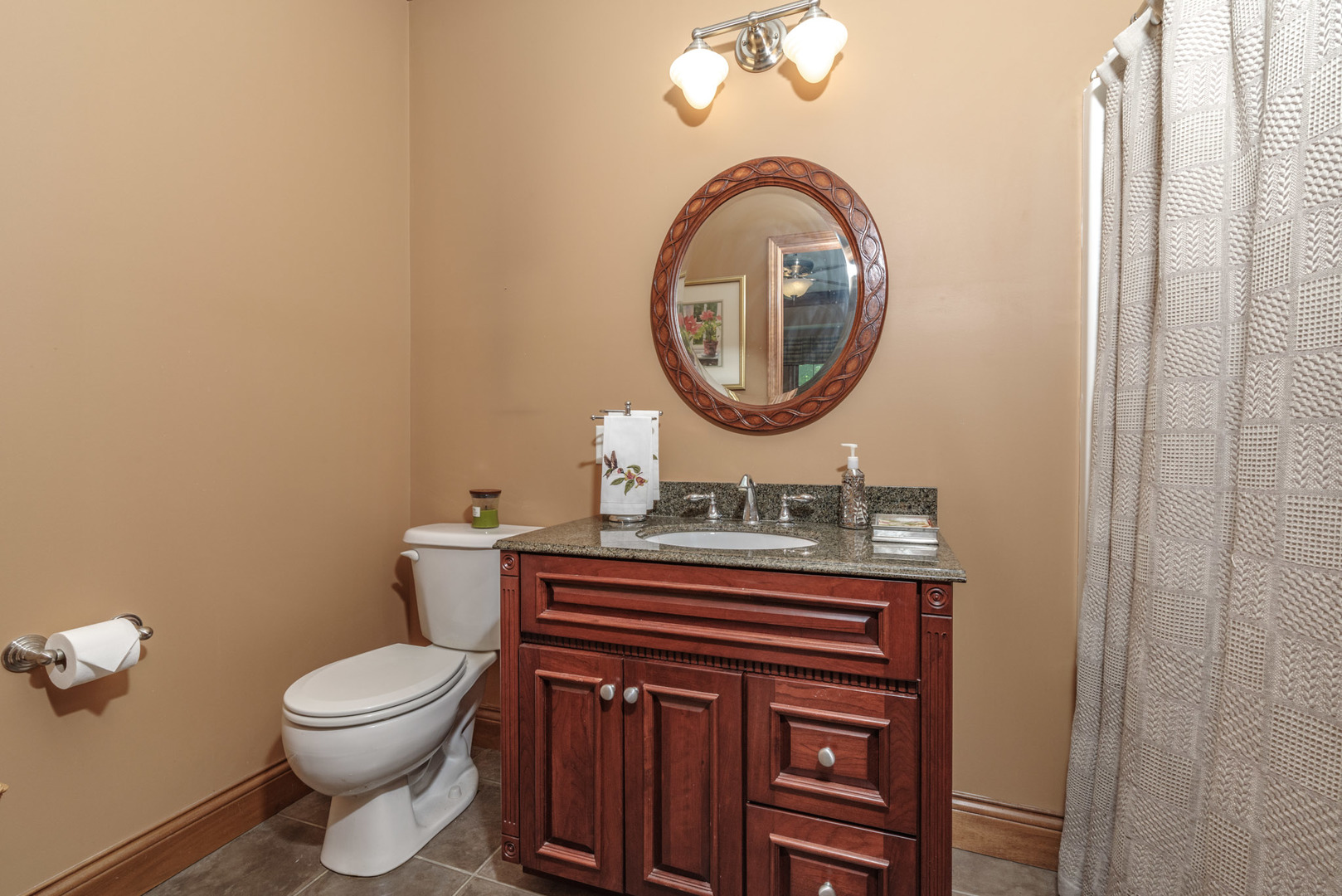 21221 Hidden Valley Loop Lexington, IL 61753 - Photo 21 of 44 a bathroom with a toilet a sink and a mirror