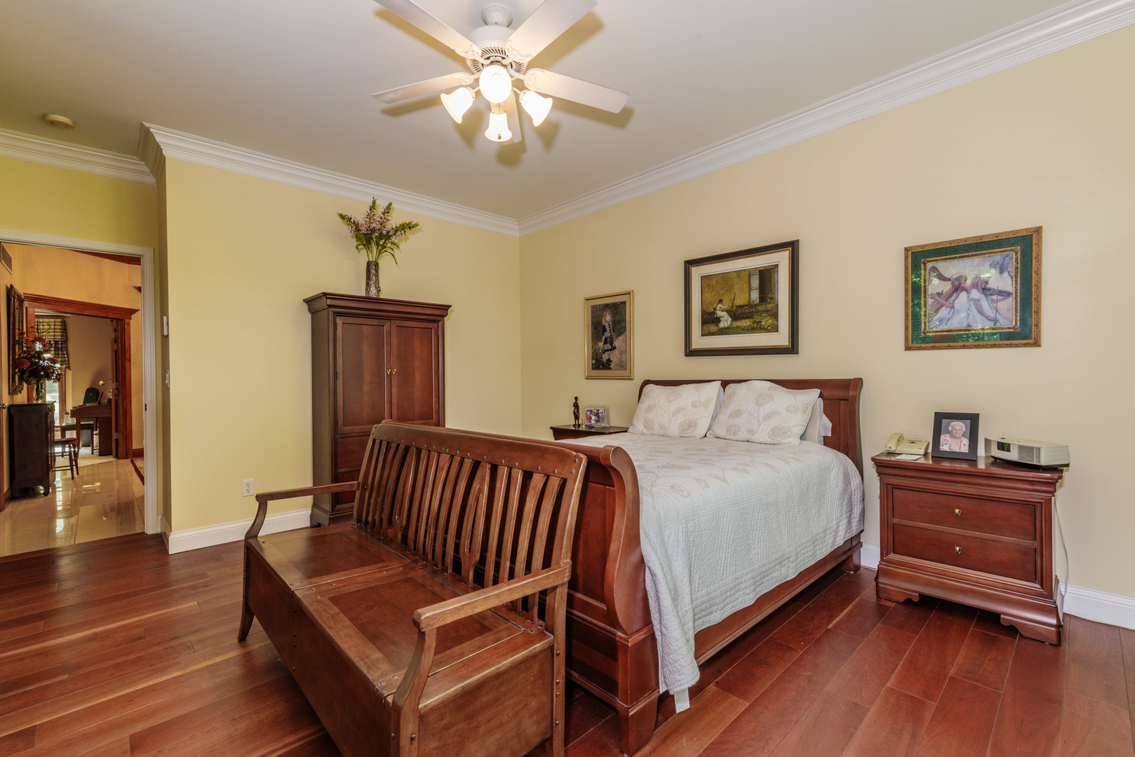 21221 Hidden Valley Loop Lexington, IL 61753 - Photo 23 of 44 a bedroom with a bed and wooden floor