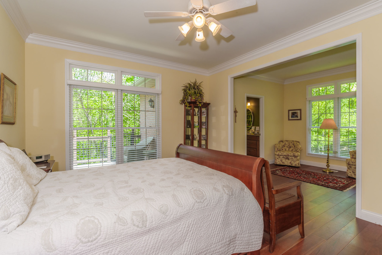 21221 Hidden Valley Loop Lexington, IL 61753 - Photo 24 of 44 a bedroom with a large bed and a large window