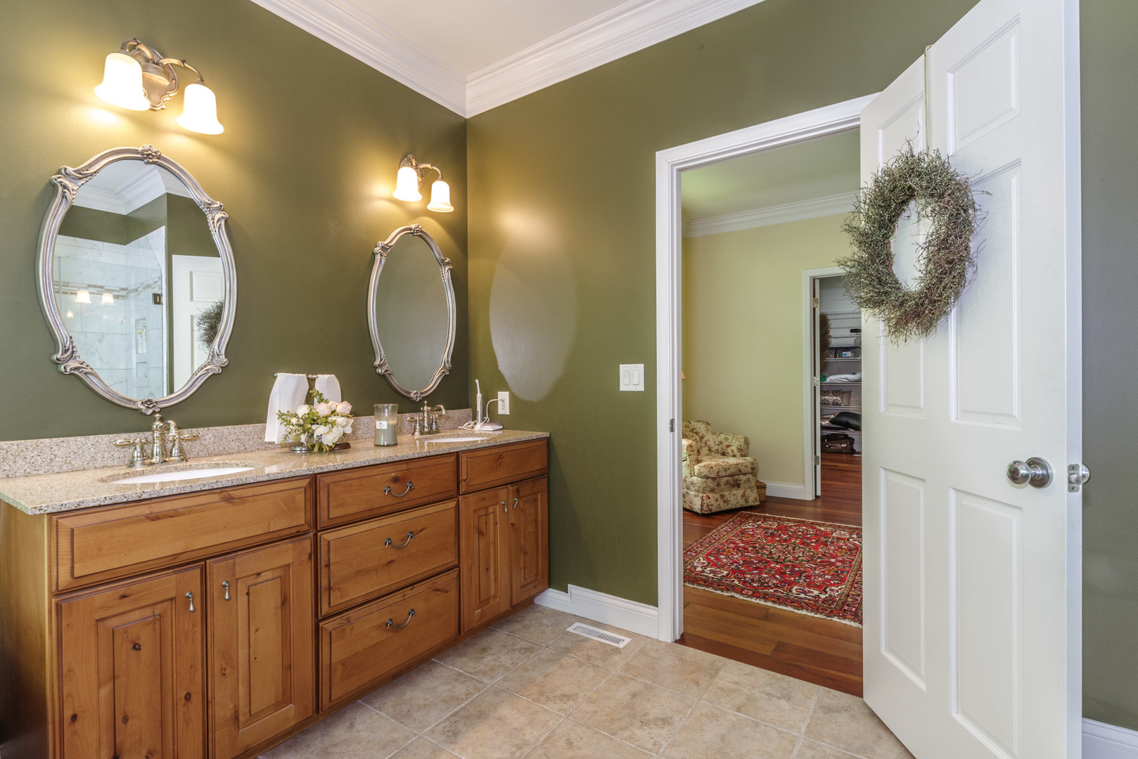 21221 Hidden Valley Loop Lexington, IL 61753 - Photo 30 of 44 a bathroom with a double vanity sink and a mirror