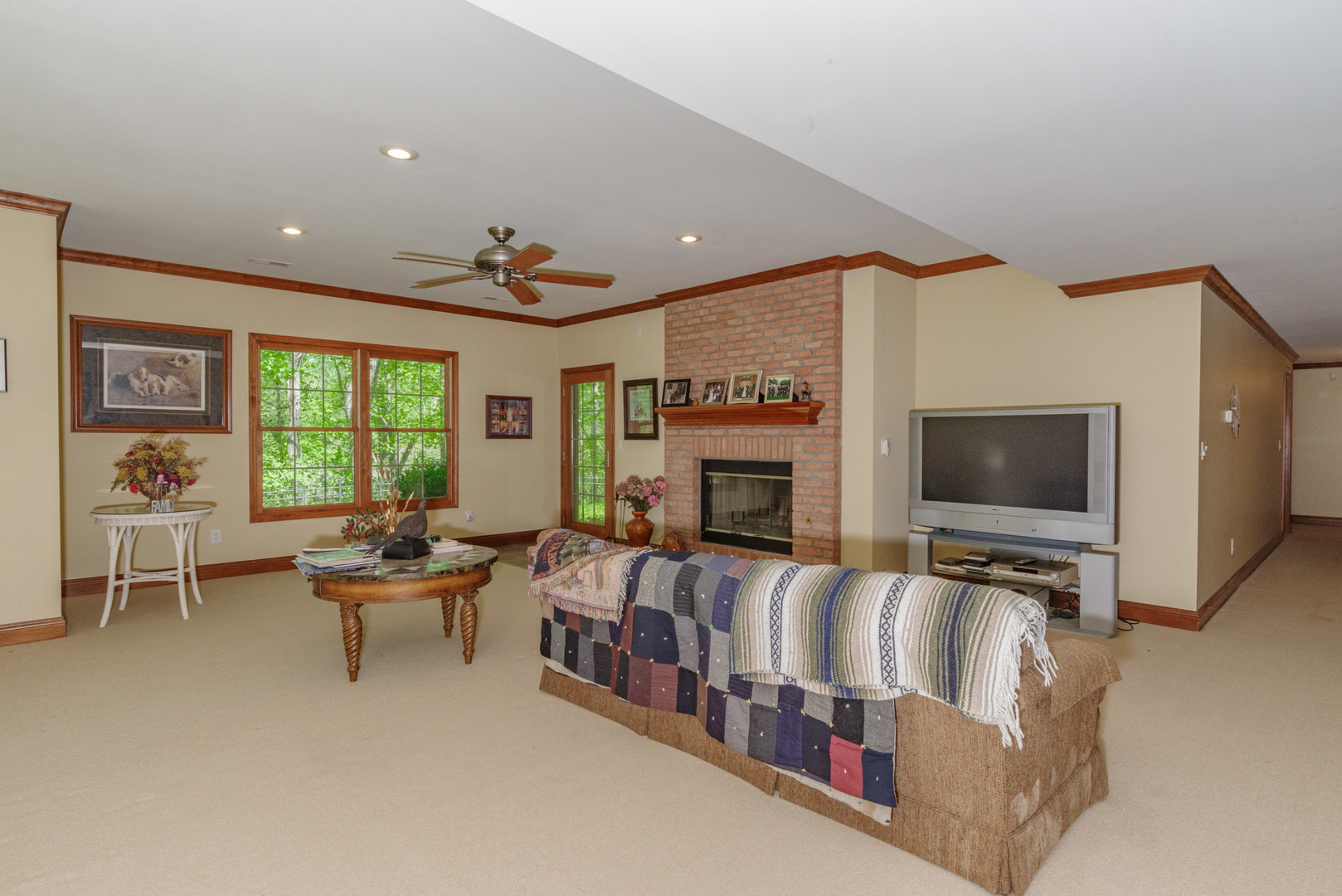 21221 Hidden Valley Loop Lexington, IL 61753 - Photo 34 of 44 a living room with furniture and a flat screen tv