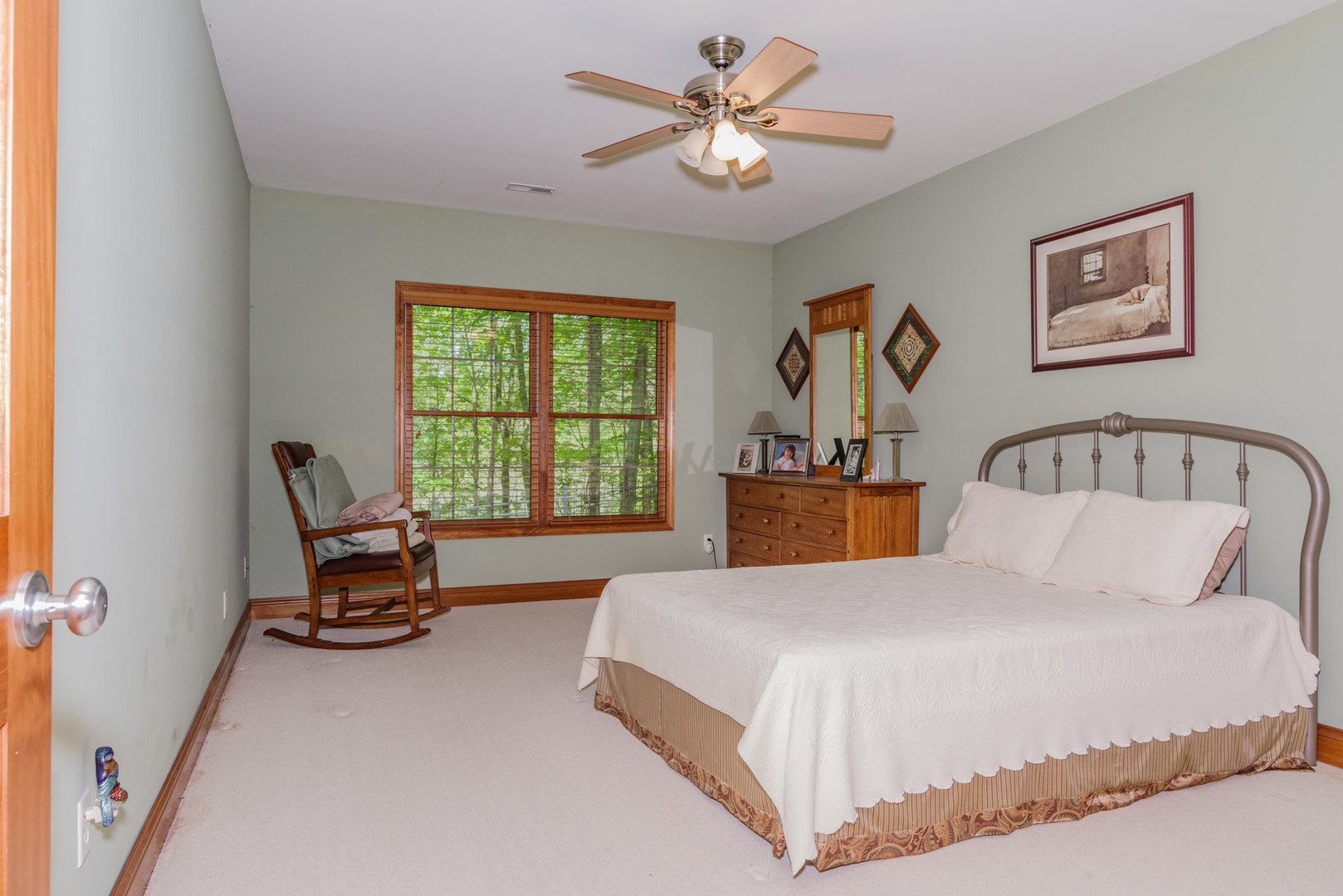 21221 Hidden Valley Loop Lexington, IL 61753 - Photo 41 of 44 a bedroom with a bed and a chandelier