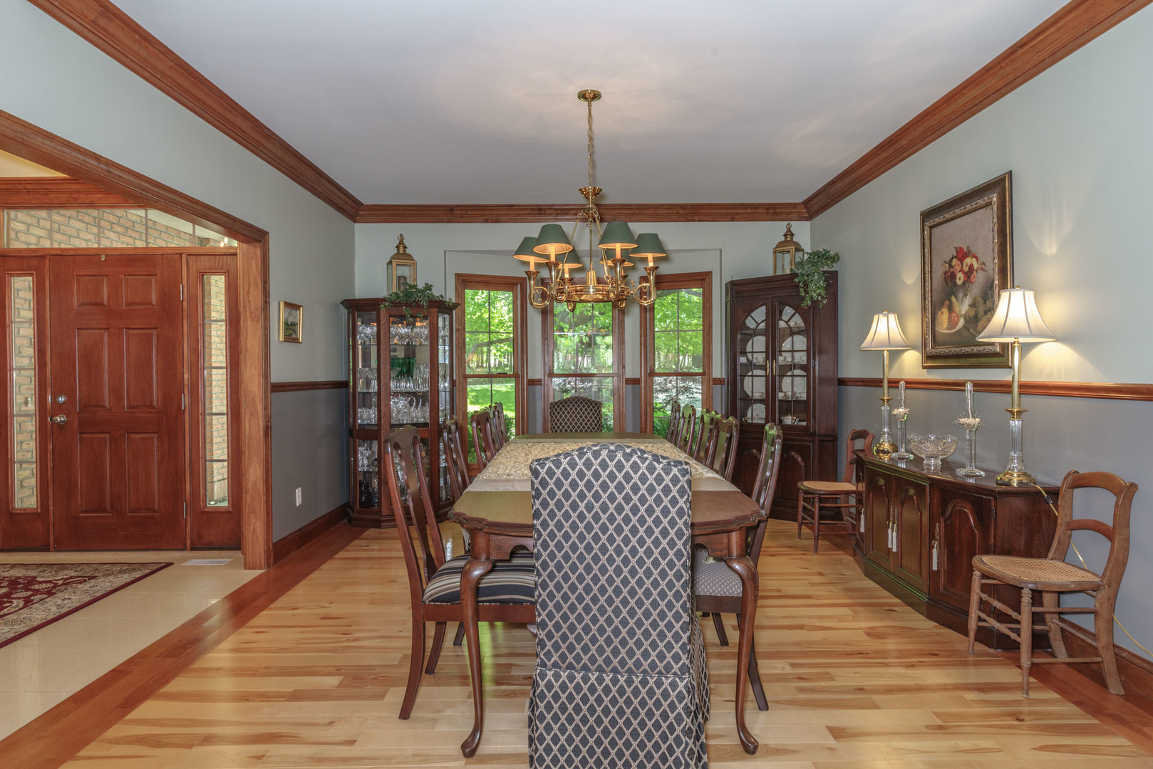 21221 Hidden Valley Loop Lexington, IL 61753 - Photo 8 of 44 a dining room with furniture a chandelier and wooden floor