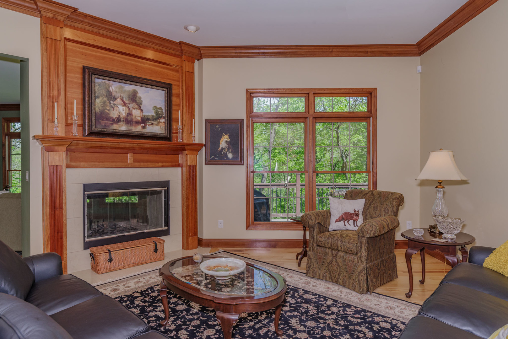 21221 Hidden Valley Loop Lexington, IL 61753 - Photo 10 of 44 a living room with furniture a rug a fireplace and a large window