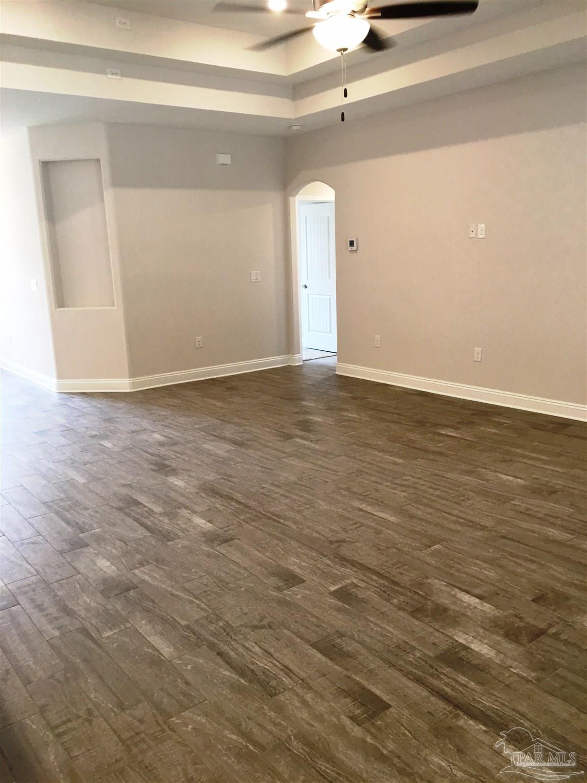 5436 South A Jones Road Milton, FL 32583 - Photo 11 of 34 Living room has a double box ceiling w/fan/light.