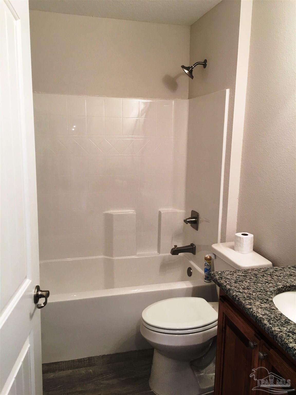 5436 South A Jones Road Milton, FL 32583 - Photo 15 of 34 2nd full bath has a shower/tub combination.