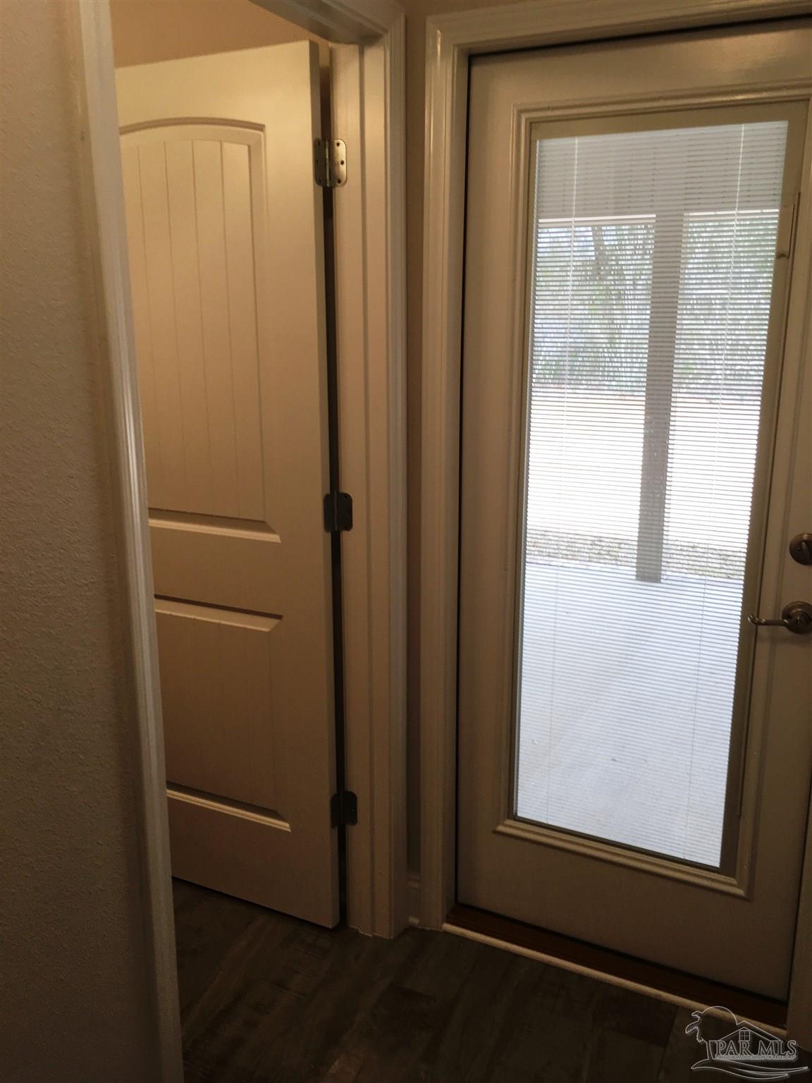5436 South A Jones Road Milton, FL 32583 - Photo 19 of 34 Rear hall leads to 1 bedroom/1 bath & patio door.