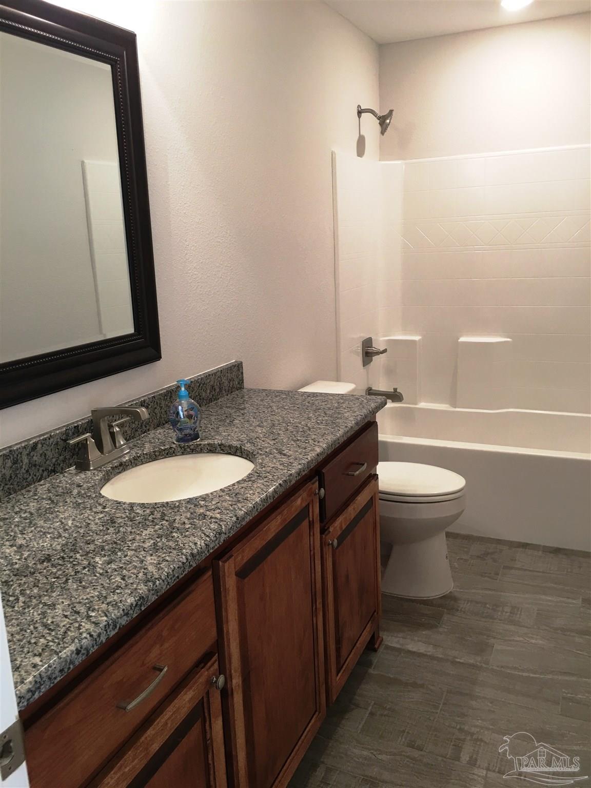 5436 South A Jones Road Milton, FL 32583 - Photo 20 of 34 A 3rd full bath has a shower/tub combo, too.