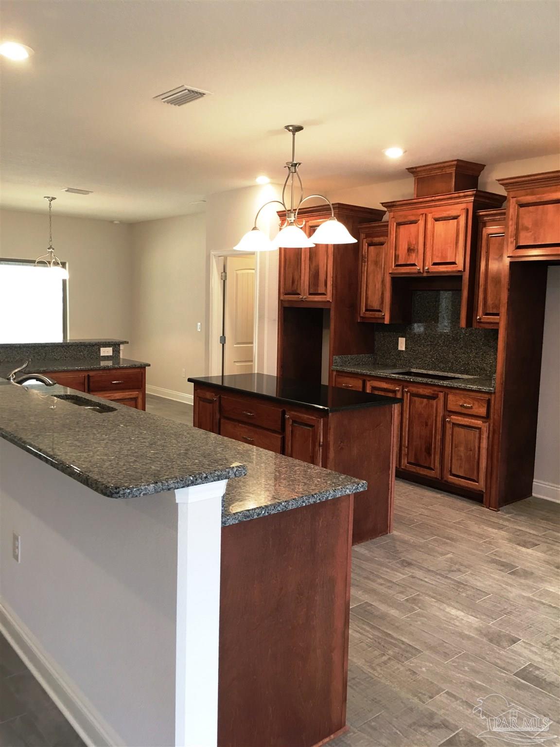 5436 South A Jones Road Milton, FL 32583 - Photo 3 of 34 Bar provides additional seating area for meals.
