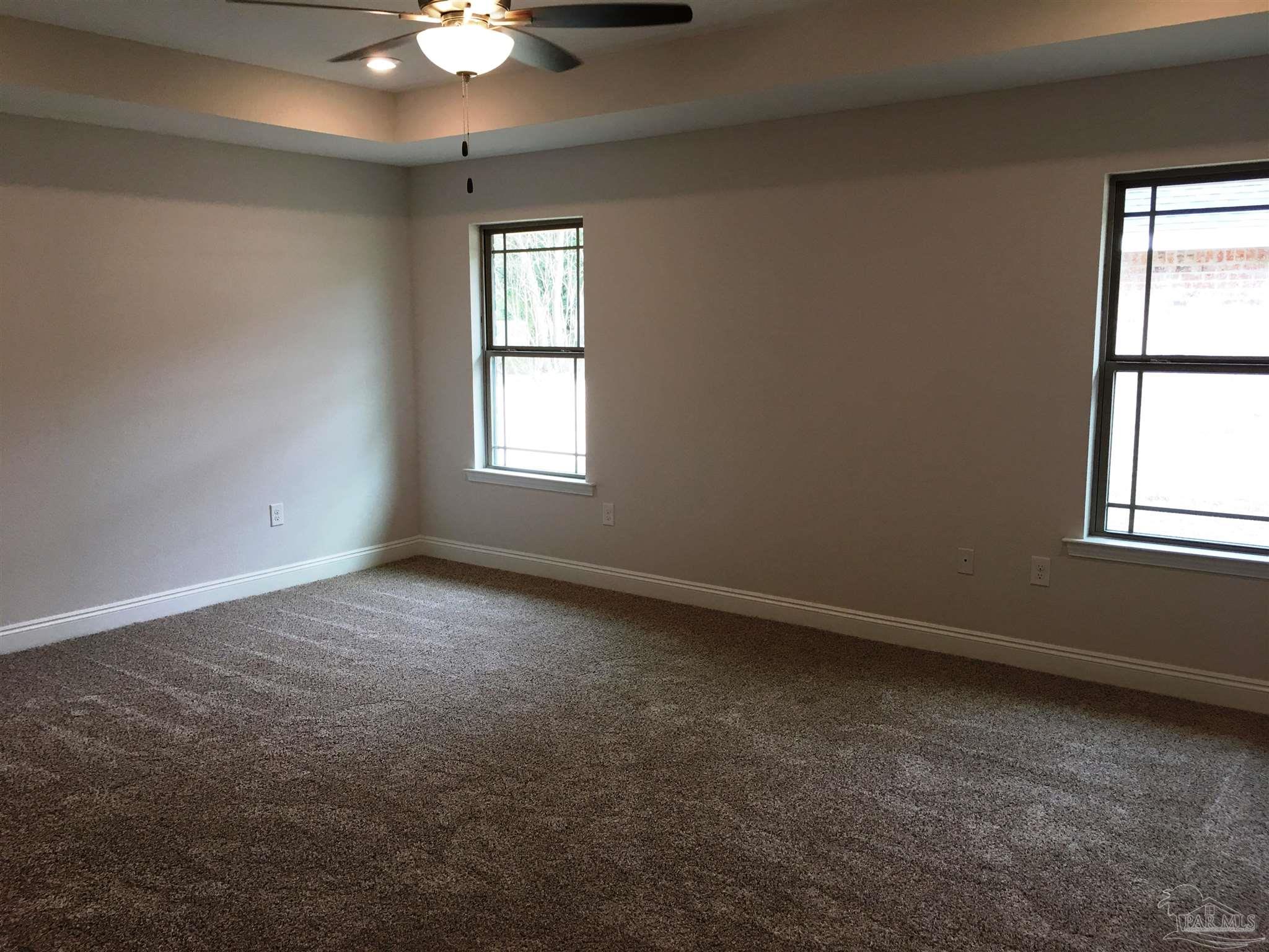 5436 South A Jones Road Milton, FL 32583 - Photo 22 of 34 Master bedroom has a box ceiling w/fan/light.