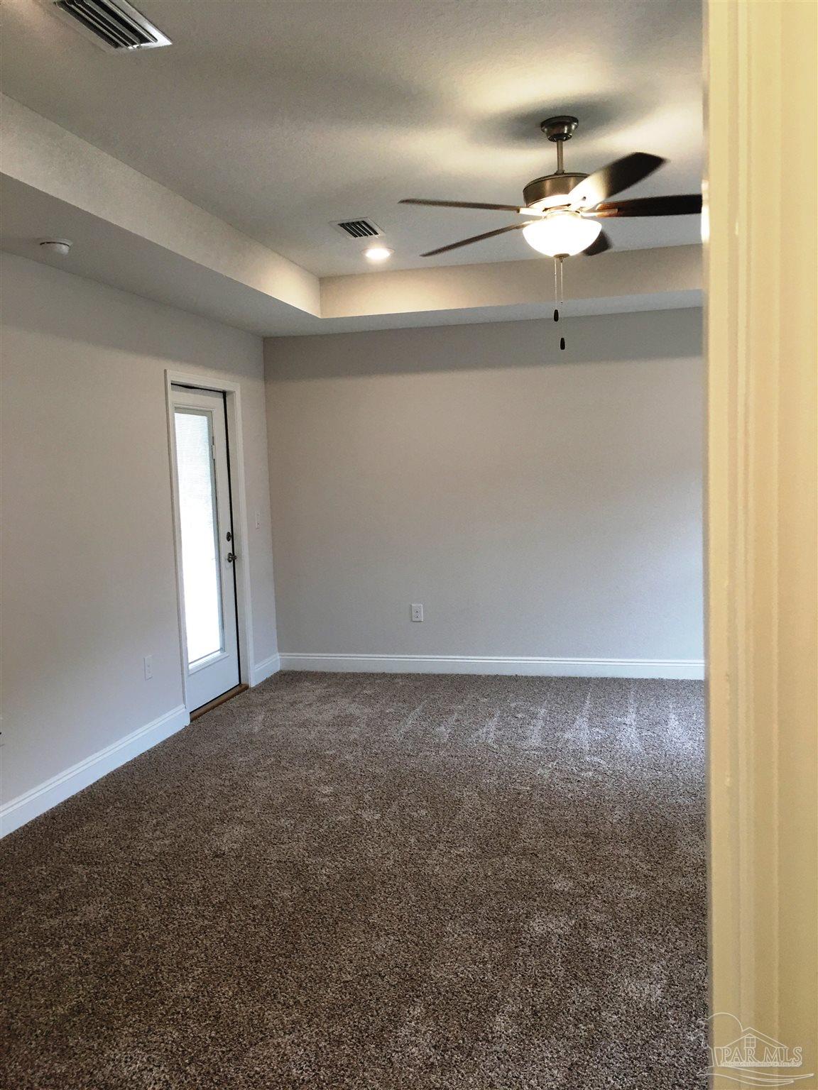 5436 South A Jones Road Milton, FL 32583 - Photo 30 of 34 Master bedroom has private entry/exit to patio.