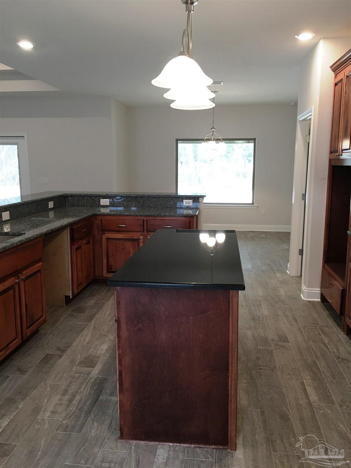 5436 South A Jones Road Milton, FL 32583 - Photo 4 of 34 Center kitchen island provides extra workspace.