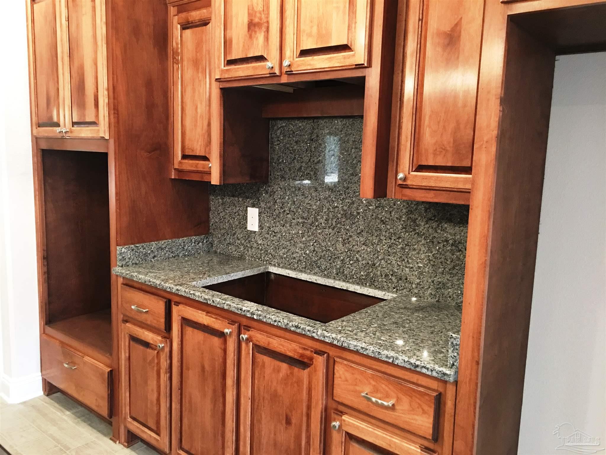 5436 South A Jones Road Milton, FL 32583 - Photo 5 of 34 Kitchen features a wall oven & separate cooktop.