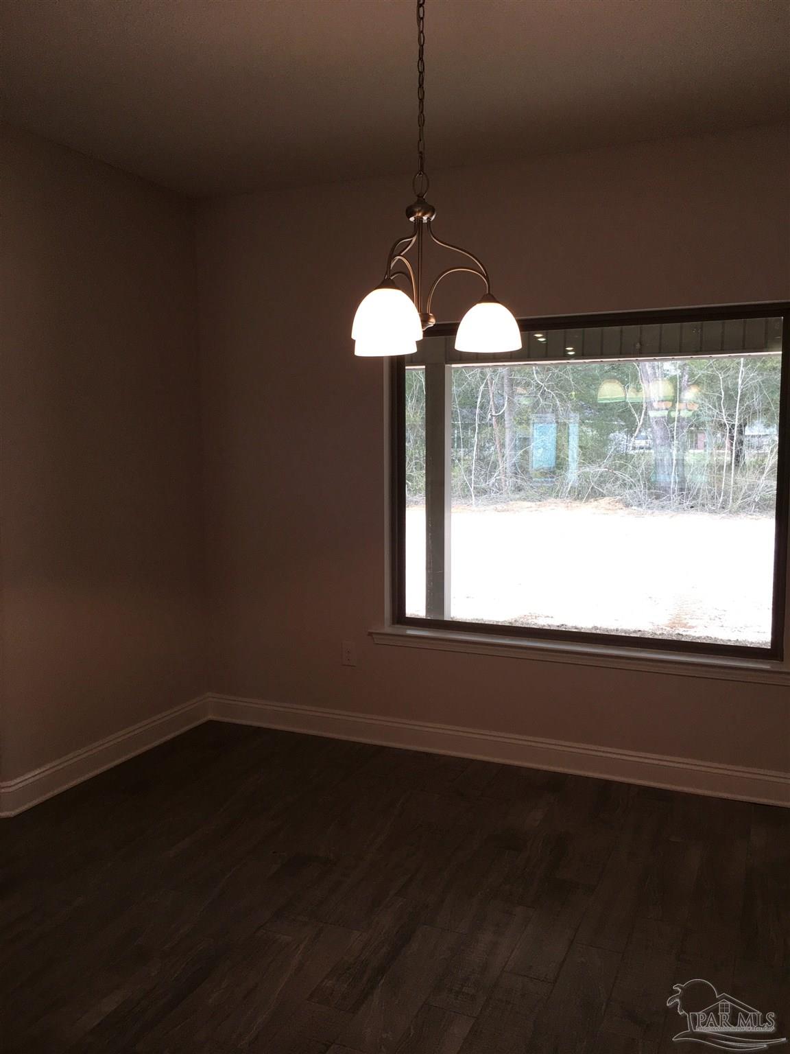 5436 South A Jones Road Milton, FL 32583 - Photo 7 of 34 The breakfast nook has an amazing picture window.