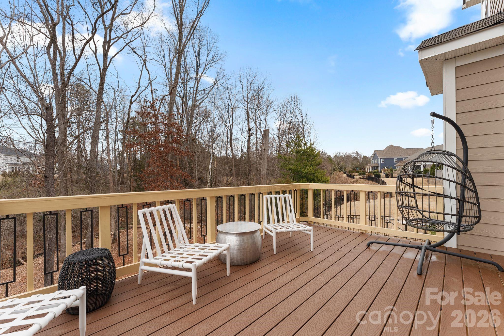 9786 Verdun Court Fort Mill, SC 29707 - Photo 13 of 41 a view of a chair on wooden deck
