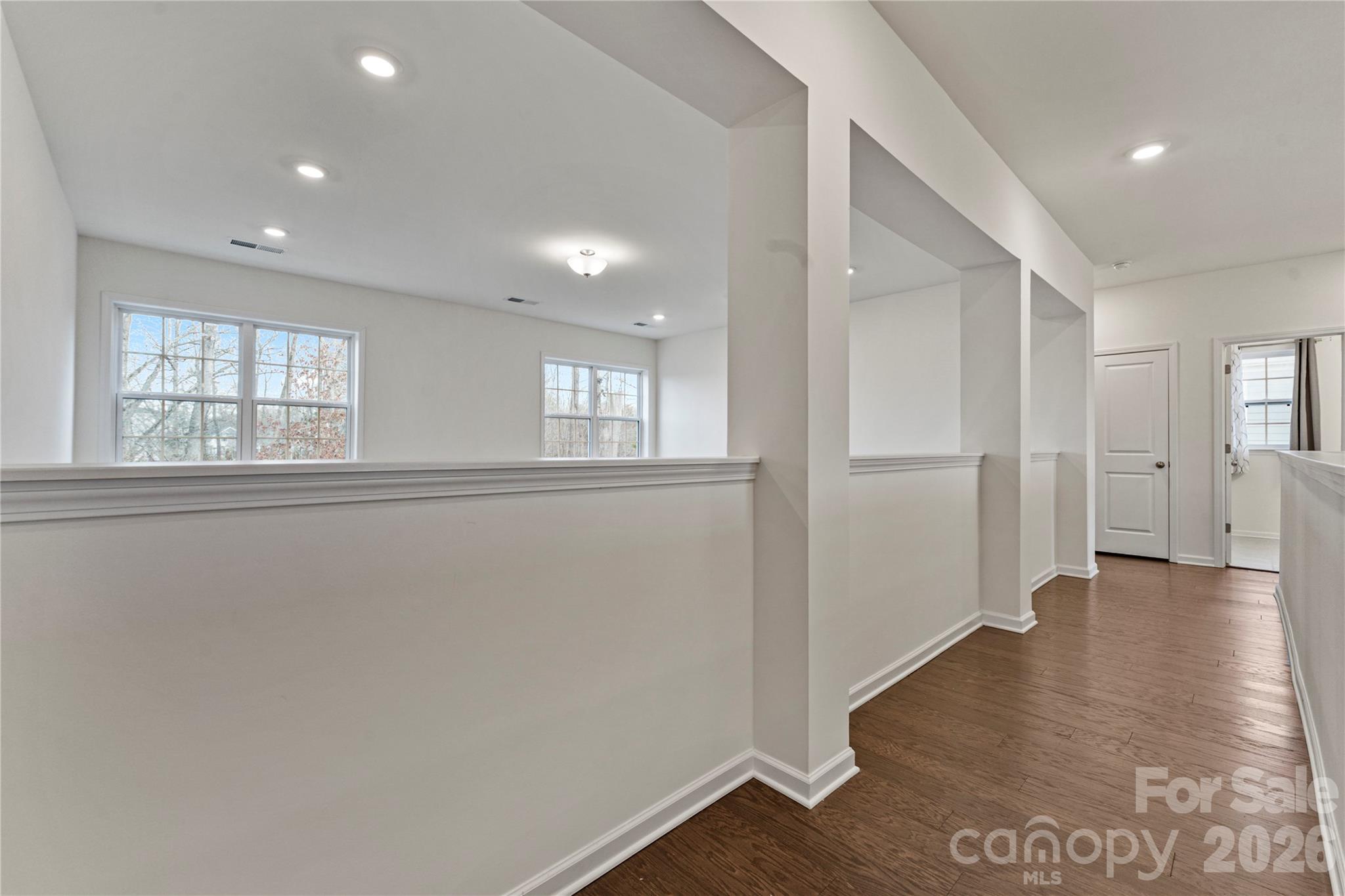 9786 Verdun Court Fort Mill, SC 29707 - Photo 16 of 41 an empty room with wooden floor and windows