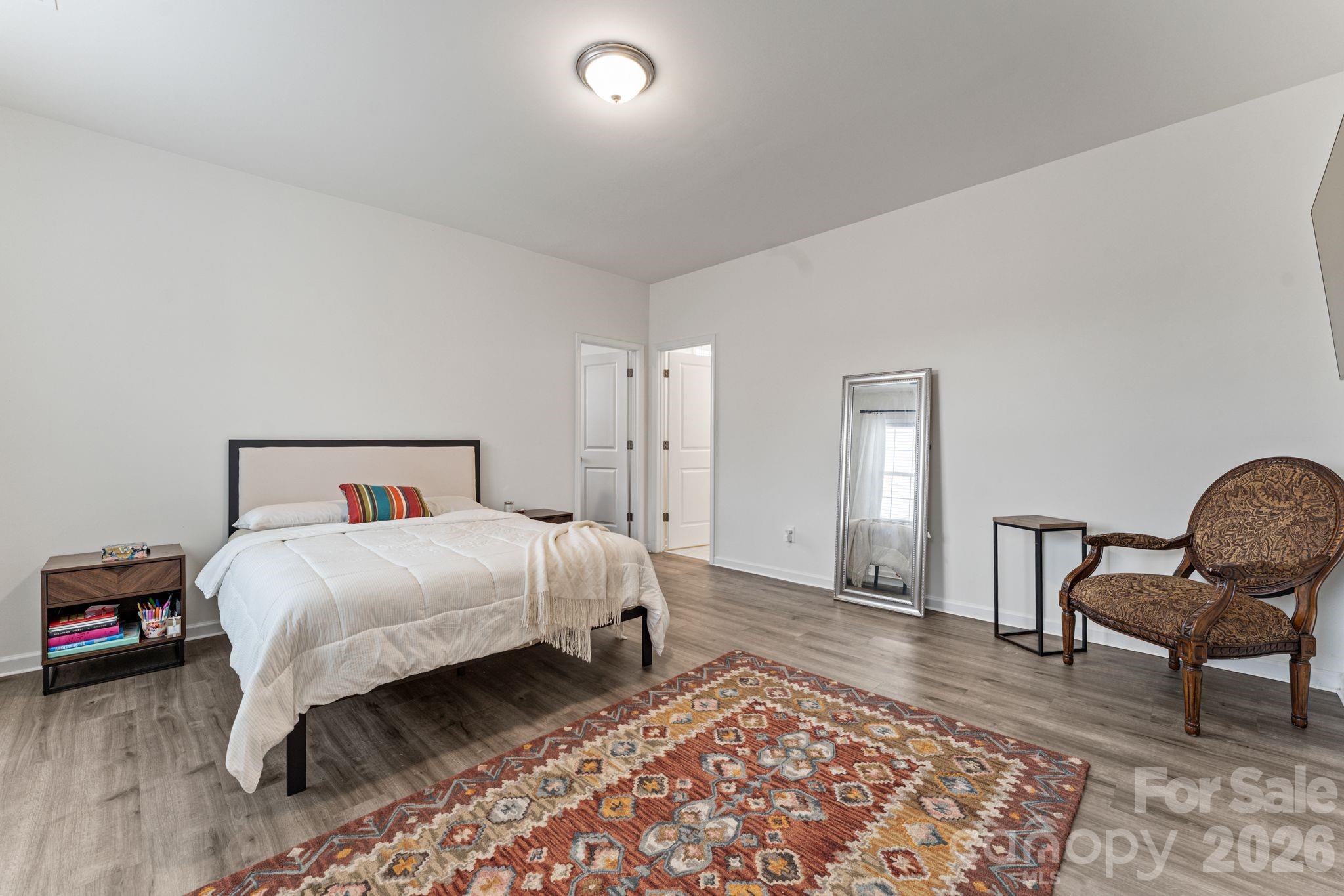 9786 Verdun Court Fort Mill, SC 29707 - Photo 21 of 41 a bedroom with a bed and a chair