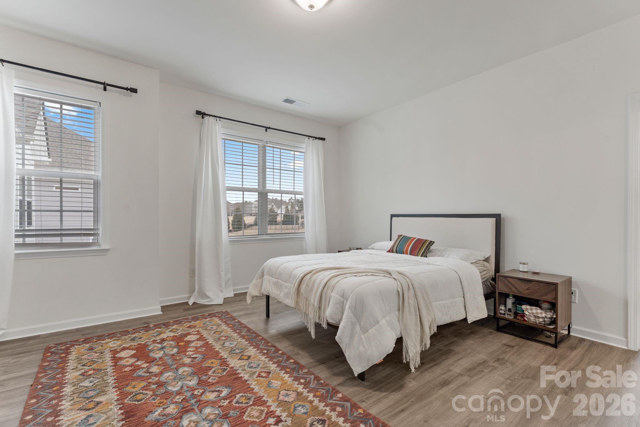 9786 Verdun Court Fort Mill, SC 29707 - Photo 22 of 41 a bed room with a bed and a window