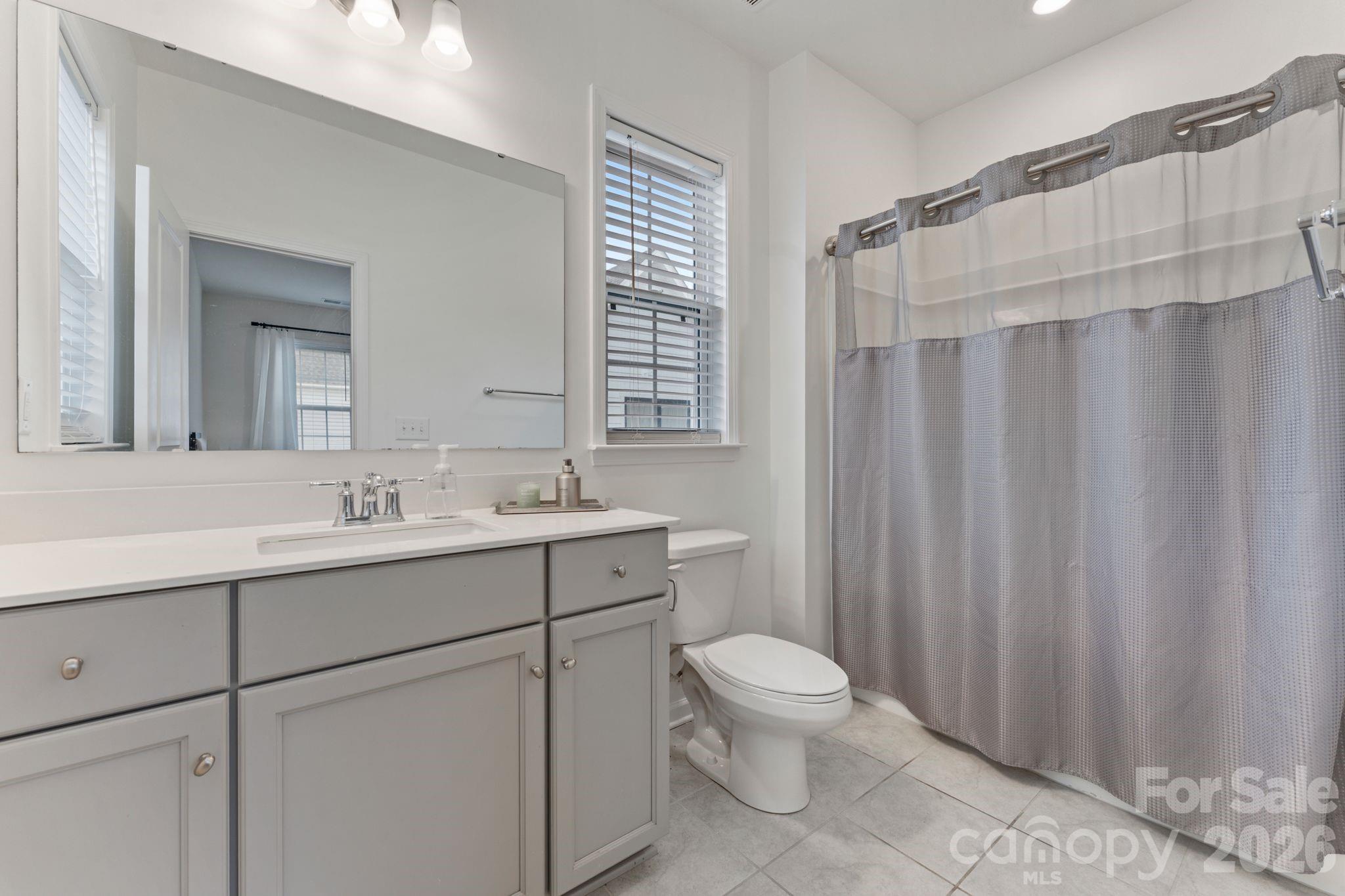 9786 Verdun Court Fort Mill, SC 29707 - Photo 23 of 41 a bathroom with a sink a toilet and shower