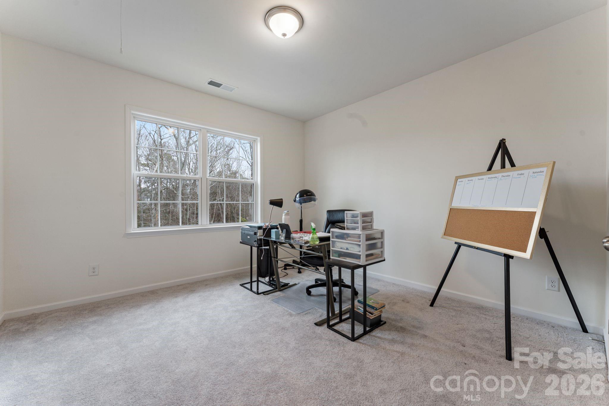 9786 Verdun Court Fort Mill, SC 29707 - Photo 24 of 41 a view of a workspace with furniture and a window
