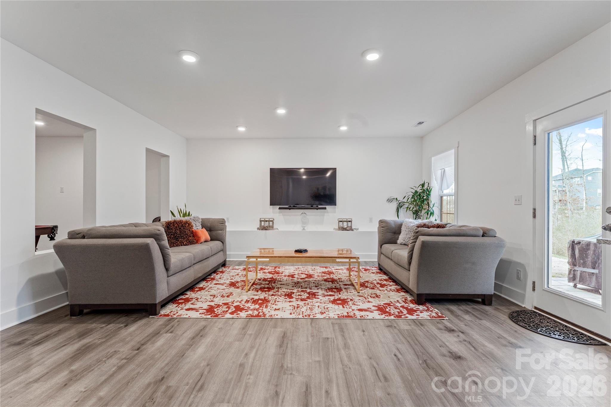 9786 Verdun Court Fort Mill, SC 29707 - Photo 26 of 41 a living room with furniture and a flat screen tv