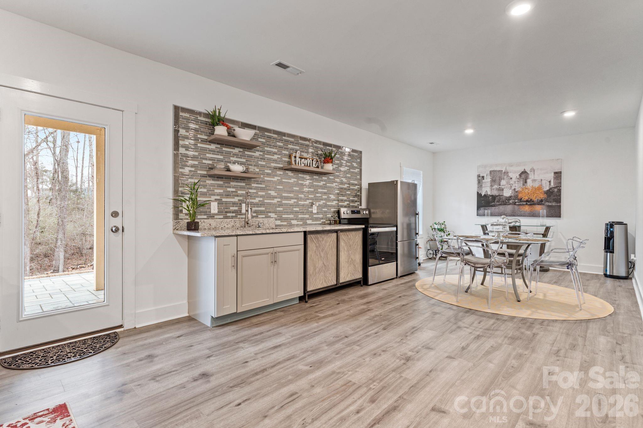 9786 Verdun Court Fort Mill, SC 29707 - Photo 28 of 41 a living room with stainless steel appliances kitchen island granite countertop furniture and a kitchen view