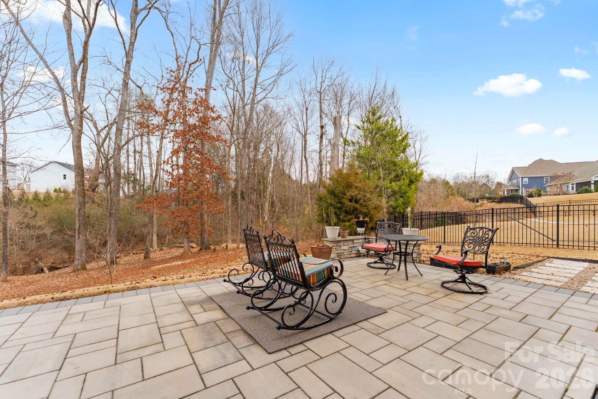 9786 Verdun Court Fort Mill, SC 29707 - Photo 34 of 41 a view of a patio with table and chairs and potted plants