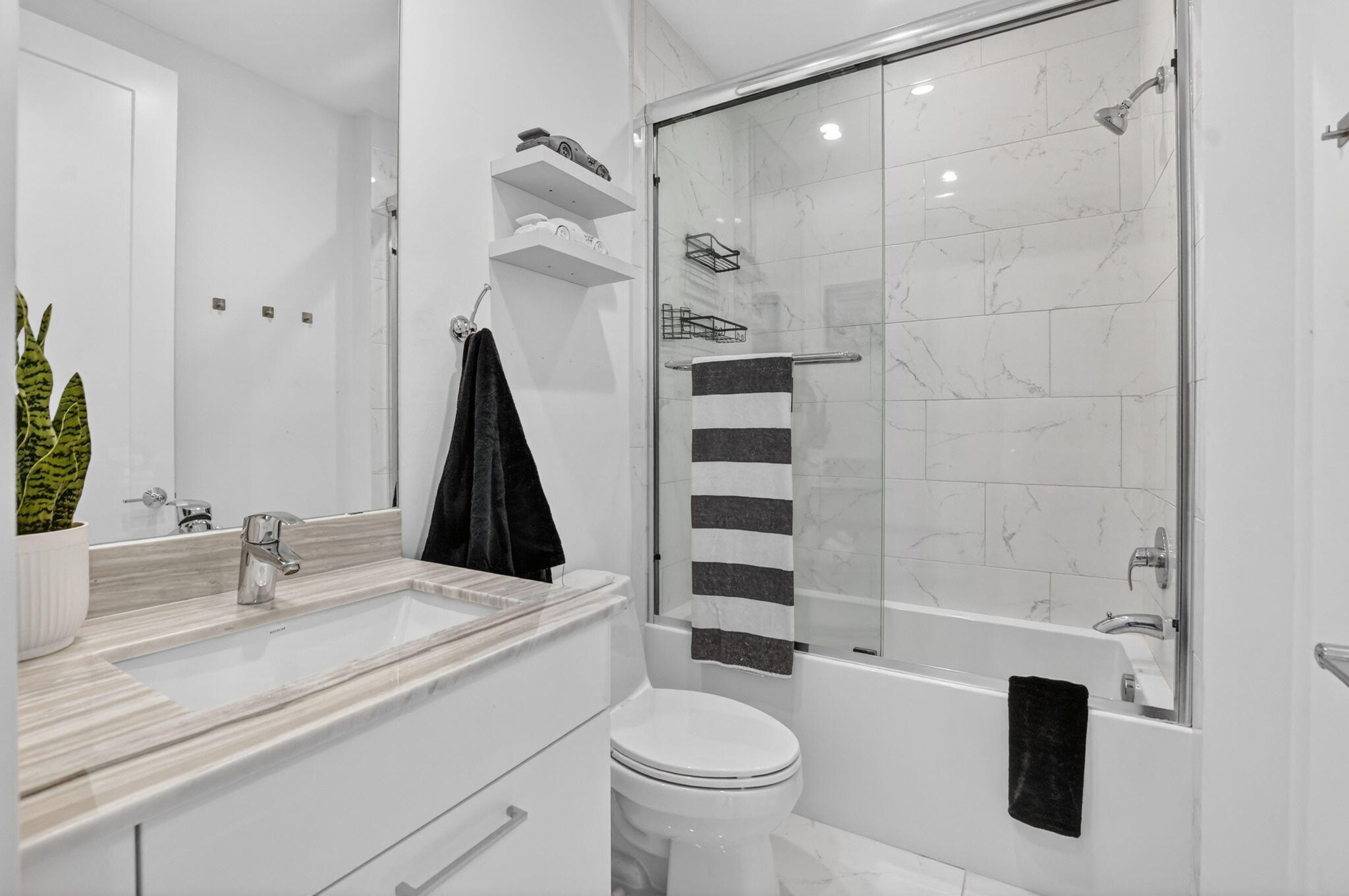 4021 Northwest 18th Way Boca Raton, FL 33431 - Photo 32 of 37 a bathroom with a sink a toilet and shower