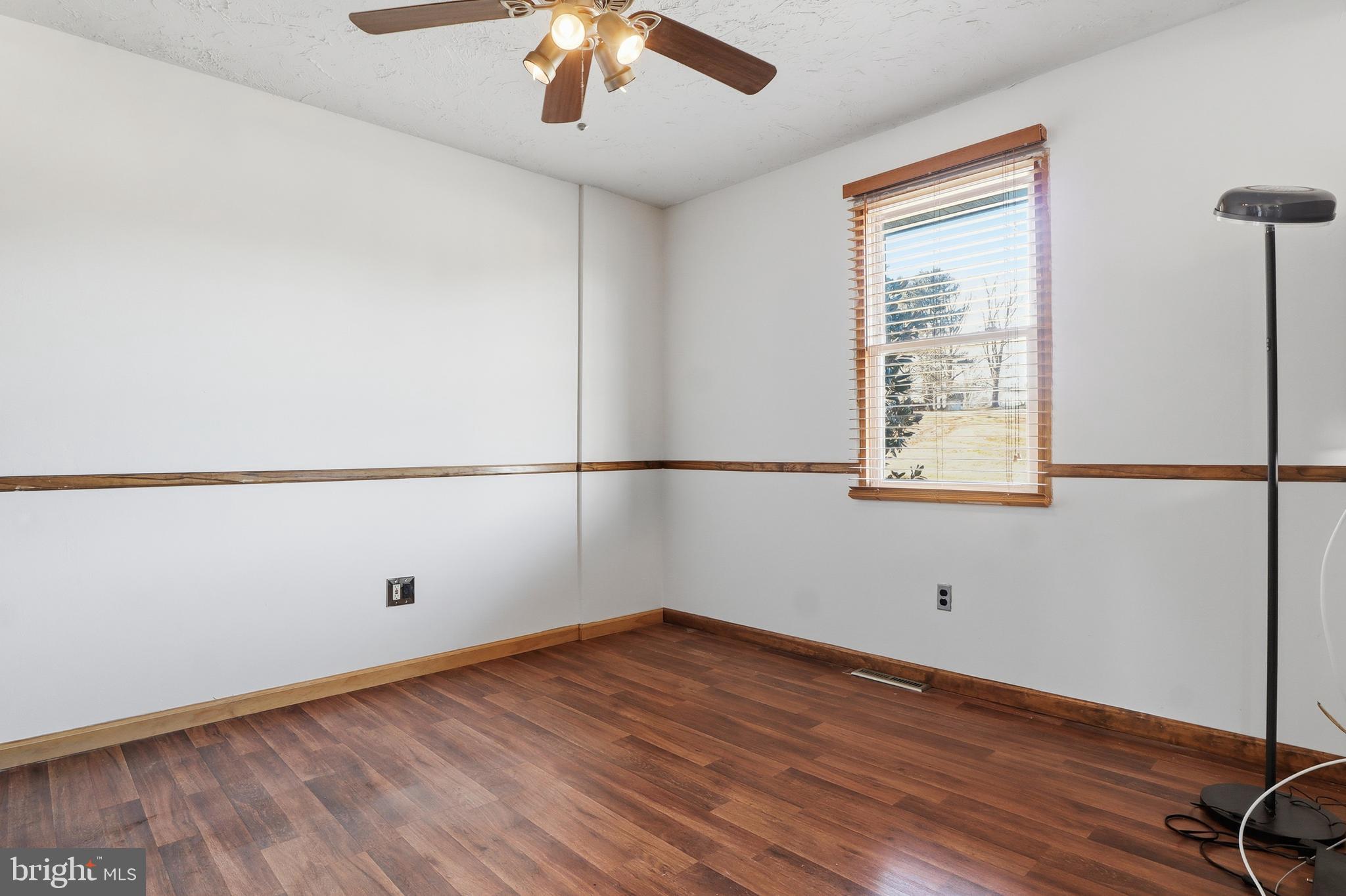 1330 Goodyear Road Gardners, PA 17324 - Photo 28 of 72 an empty room with wooden floor and windows